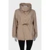 Beige windbreaker with gold hardware