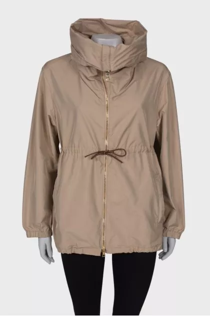 Beige windbreaker with gold hardware