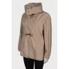 Beige windbreaker with gold hardware