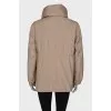 Beige windbreaker with gold hardware