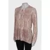 White jumper in pink and gray print