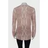 White jumper in pink and gray print