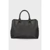 Black leather bag with brand logo