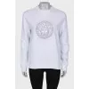 Sweatshirt decorated with beads