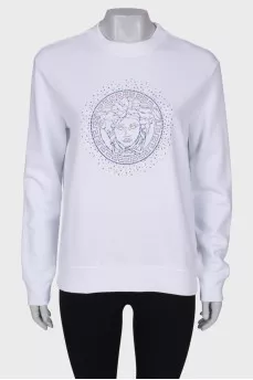 Sweatshirt decorated with beads