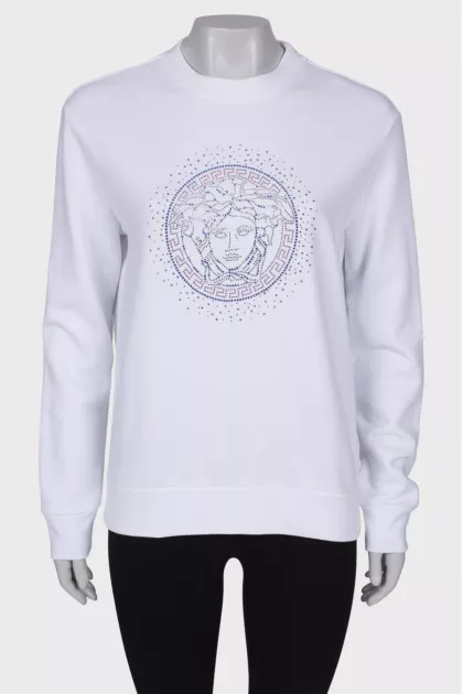 Sweatshirt decorated with beads