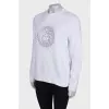 Sweatshirt decorated with beads