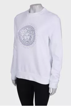 Sweatshirt decorated with beads