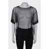 Translucent blouse with rhinestones with a tag