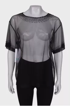 Translucent blouse with rhinestones with a tag