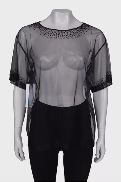 Translucent blouse with rhinestones with a tag