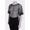 Translucent blouse with rhinestones with a tag