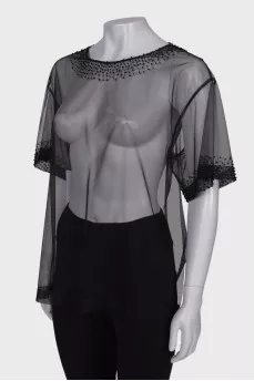 Translucent blouse with rhinestones with a tag