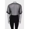 Translucent blouse with rhinestones with a tag