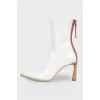 White pointed toe ankle boots