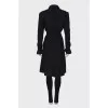 Black double-breasted trench coat with belt