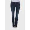 Dark blue ripped and stained jeans
