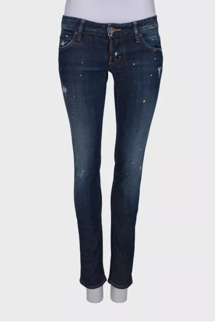 Dark blue ripped and stained jeans