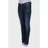 Dark blue ripped and stained jeans