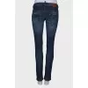 Dark blue ripped and stained jeans