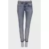 Light blue jeans with embellished belt