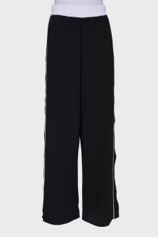 Black and white trousers with press-stud closure