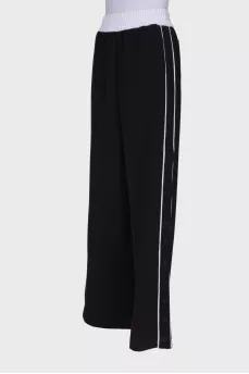 Black and white trousers with press-stud closure