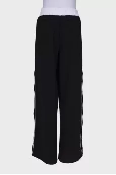 Black and white trousers with press-stud closure