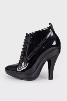 Perforated patent leather ankle boots