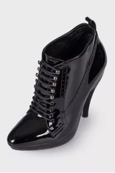 Perforated patent leather ankle boots