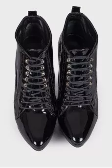 Perforated patent leather ankle boots
