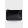 Lacquered black zip clutch