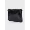 Lacquered black zip clutch