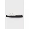 Black and white leather slippers