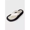 Black and white leather slippers