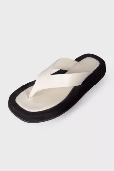 Black and white leather slippers