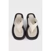 Black and white leather slippers