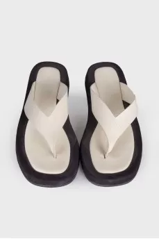 Black and white leather slippers