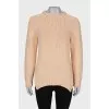 Beige long sweater, with a tag