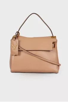 Beige bag with gold hardware