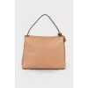 Beige bag with gold hardware