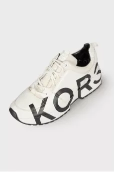 White sneakers with brand logo