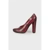 Maroon leather pumps