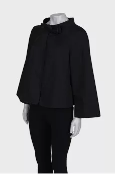Jacket decorated with a bow