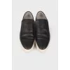 Perforated leather slip-ons