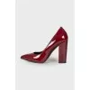 Maroon patent leather shoes