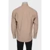 Men's beige shirt with a pocket