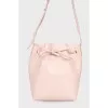Vertical shoulder bag with tag
