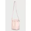 Vertical shoulder bag with tag