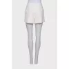 White shorts with golden buttons
